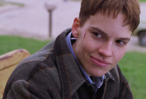 Hilary Swank as Brandon Teena, a young trans man who was murdered in Boys Don't Cry.